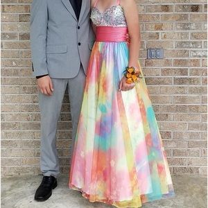 The colorful dress it is a corset back and has straps that can be removed.